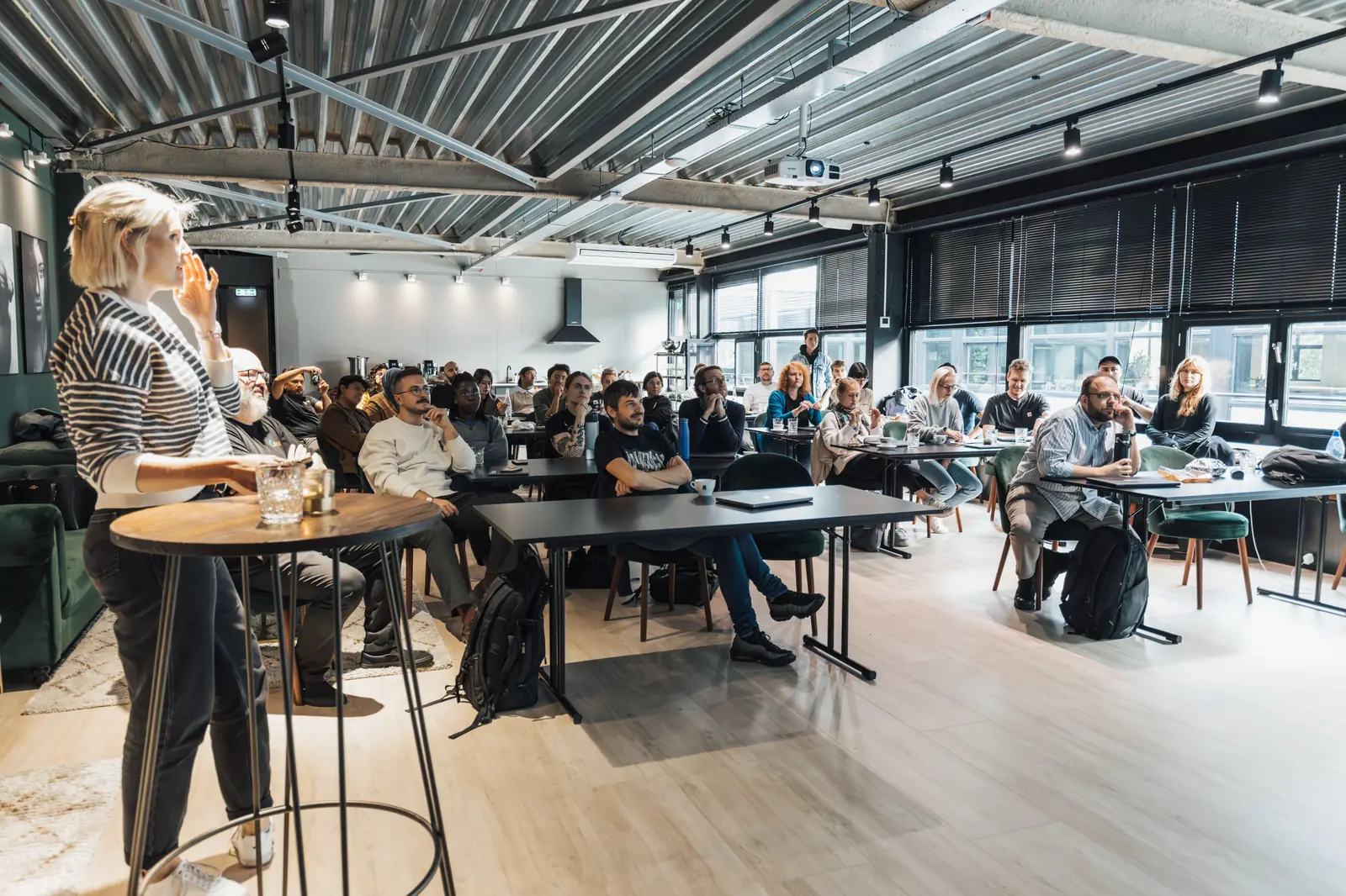 A speaker holding a full room of students